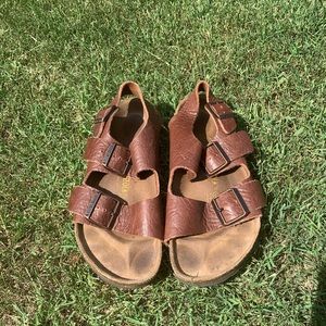 Brown leather Birkenstocks with heel strap